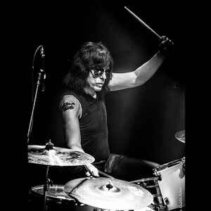 Marky Ramones sitting at his drumkit